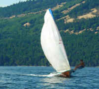 Fast planing flying spinnaker from sliding seat
